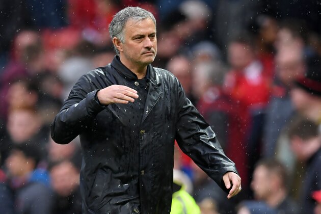 Manchester United's Portuguese manager Jose Mourinho walks off after the English Premier League football match between Manchester United and West Bomwich Albion at Old Trafford in Manchester, north west England, on April 15, 2018.
Manchester City were crowned Premier League champions on Sunday as Manchester United crashed to a shock 1-0 defeat against West Bromwich Albion. / AFP PHOTO / Paul ELLIS / RESTRICTED TO EDITORIAL USE. No use with unauthorized audio, video, data, fixture lists, club/league logos or 'live' services. Online in-match use limited to 75 images, no video emulation. No use in betting, games or single club/league/player publications.  /         (Photo credit should read PAUL ELLIS/AFP/Getty Images)