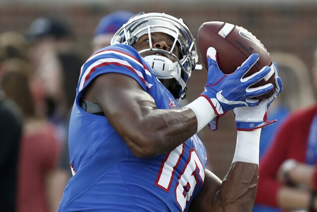 SMU wide receiver Courtland Sutton (16) participates in warm-up drills before the start of an NCAA college football game against Central Florida, Saturday, Nov. 4, 2017, in Dallas. (AP Photo/Mike Stone)
