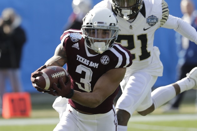 Texas A&M's Christian Kirk (3) catches a pass as Wake Forest's Essang Bassey (21) defends during the first half of the Belk Bowl NCAA college football game in Charlotte, N.C., Friday, Dec. 29, 2017. (AP Photo/Chuck Burton)