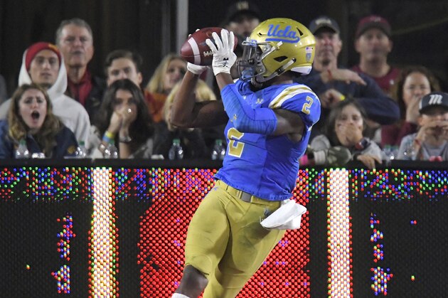 UCLA wide receiver Jordan Lasley, left, makes a touchdown catch as Southern California safety Marvell Tell III watches during the second half of an NCAA college football game Saturday, Nov. 18, 2017, in Los Angeles. USC won 28-23. (AP Photo/Mark J. Terrill) UCLA wide receiver Jordan Lasley, left, makes a touchdown catch as Southern California safety Marvell Tell III watches during the second half of an NCAA college football game Saturday, Nov. 18, 2017, in Los Angeles. USC won 28-23. (AP Photo/Mark J. Terrill)