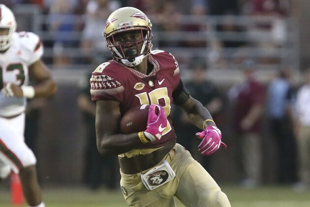 Florida State receiver Auden Tate picks up yardage after a reception in an NCAA college football game with Miami, Saturday, Oct. 7, 2017, in Tallahassee, Fla. Miami won 24-20. (AP Photo/Steve Cannon)