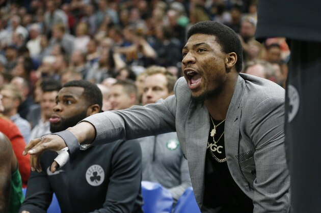 Boston Celtics guard Marcus Smart shouts to his team as he sits on the bench in the second half of the team's NBA basketball game against the Utah Jazz on Wednesday, March 28, 2018, in Salt Lake City. (AP Photo/Rick Bowmer) Boston Celtics guard Marcus Smart shouts to his team as he sits on the bench in the second half of the team's NBA basketball game against the Utah Jazz on Wednesday, March 28, 2018, in Salt Lake City. (AP Photo/Rick Bowmer)