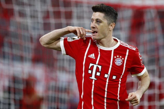 Bayern's Robert Lewandowski celebrates after scoring his side's fifth goal during the German Bundesliga soccer match between FC Bayern Munich and Borussia Moenchengladbach in Munich, Germany, Saturday, April 14, 2018. (AP Photo/Matthias Schrader)