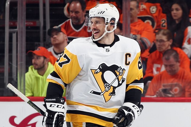 PHILADELPHIA, PA - APRIL 15: Sidney Crosby #87 of the Pittsburgh Penguins celebrates a second period goal by Evgeni Malkin #71 (not shown) against the Philadelphia Flyers in Game Three of the Eastern Conference First Round during the 2018 NHL Stanley Cup Playoffs at the Wells Fargo Center on April 15, 2018 in Philadelphia, Pennsylvania.  (Photo by Bruce Bennett/Getty Images)