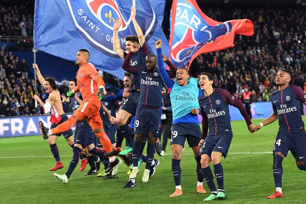Paris Saint-Germain's players celebrate after winning the French L1 football match between Paris Saint-Germain (PSG) and Monaco (ASM) on April 15, 2018, at the Parc des Princes stadium in Paris.
Paris Saint-Germain won the match and claimed their seventh French League title. / AFP PHOTO / CHRISTOPHE ARCHAMBAULT (Photo credit should read CHRISTOPHE ARCHAMBAULT/AFP/Getty Images) Paris Saint-Germain's players celebrate after winning the French L1 football match between Paris Saint-Germain (PSG) and Monaco (ASM) on April 15, 2018, at the Parc des Princes stadium in Paris.
Paris Saint-Germain won the match and claimed their seventh French League title. / AFP PHOTO / CHRISTOPHE ARCHAMBAULT (Photo credit should read CHRISTOPHE ARCHAMBAULT/AFP/Getty Images)
