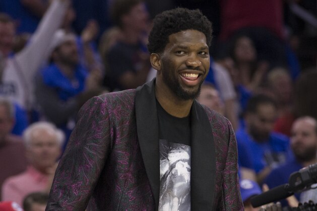 PHILADELPHIA, PA - APRIL 14: Joel Embiid #21 of the Philadelphia 76ers reacts from the bench against the Miami Heat during Game One of the first round of the 2018 NBA Playoff at Wells Fargo Center on April 14, 2018 in Philadelphia, Pennsylvania. NOTE TO USER: User expressly acknowledges and agrees that, by downloading and or using this photograph, User is consenting to the terms and conditions of the Getty Images License Agreement. (Photo by Mitchell Leff/Getty Images) *** Local Caption *** Joel Embiid