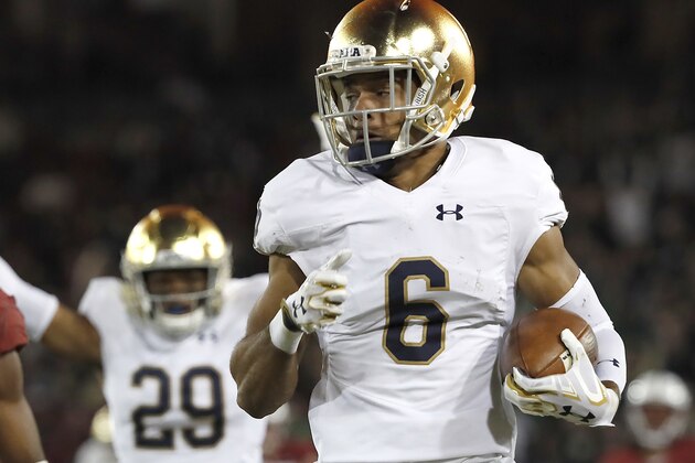 Notre Dame wide receiver Equanimeous St. Brown (6) runs for a touchdown after catching a pass past Stanford safety Justin Reid (8) during the second half of an NCAA college football game Saturday, Nov. 25, 2017, in Stanford, Calif. (AP Photo/Tony Avelar)