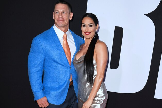 John Cena and Nikki Bella arrive for the premiere of 'Blockers' in Los Angeles, California on April 3, 2018. / AFP PHOTO / Frederic J. Brown        (Photo credit should read FREDERIC J. BROWN/AFP/Getty Images)