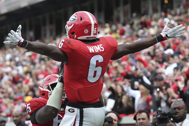 Georgia wide receiver Javon Wims (6) celebrates his touchdown against Georgia Tech during the first half of an NCAA college football game, Saturday, Nov. 25, 2017, in Atlanta. (AP Photo/John Bazemore)