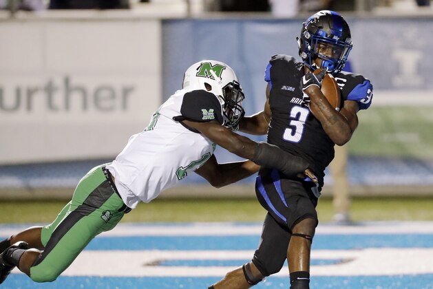 Middle Tennessee wide receiver Richie James (3) scores a touchdown against Marshall safety Nazeeh Johnson (13) in the first half of an NCAA college football game Friday, Oct. 20, 2017, in Murfreesboro, Tenn. (AP Photo/Mark Humphrey)
