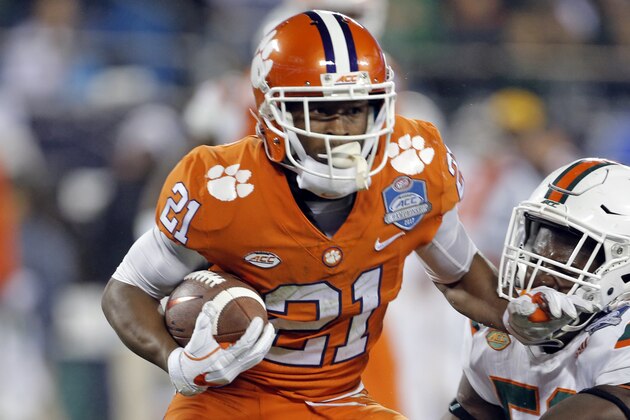 Clemson's Ray-Ray McCloud (21) is tackled by Miami's Zach McCloud (53) during the first half of the Atlantic Coast Conference championship NCAA college football game in Charlotte, N.C., Saturday, Dec. 2, 2017. (AP Photo/Bob Leverone)
