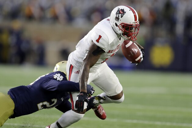 North Carolina State's Jaylen Samuels is tackled by Notre Dame's Nick Coleman during the second half of an NCAA college football game, Saturday, Oct. 28, 2017, in South Bend, Ind. Notre Dame won 35-14. (AP Photo/Darron Cummings)