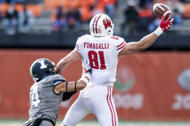 Wisconsin tight end Troy Fumagalli (81) tries to make a catch as Illinois defensive back Bennett Williams (4) defends during an NCAA college football game Saturday, Oct. 28, 2017 at Memorial Stadium in Champaign, Ill. Wisconsin defeated Illinois 24-10. (AP Photo/Bradley Leeb)