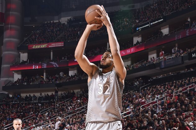 HOUSTON, TX - APRIL 15: Karl-Anthony Towns #32 of the Minnesota Timberwolves shoots the ball against the Houston Rockets in Game One of Round One of the 2018 NBA Playoffs on April 15, 2018 at the Toyota Center in Houston, Texas. NOTE TO USER: User expressly acknowledges and agrees that, by downloading and or using this photograph, User is consenting to the terms and conditions of the Getty Images License Agreement. Mandatory Copyright Notice: Copyright 2018 NBAE (Photo by Bill Baptist/NBAE via Getty Images)