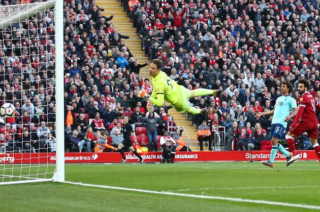 LIVERPOOL, ENGLAND - APRIL 14:  Mohamed Salah of Liverpool scores his sides second goal past Asmir Begovic of AFC Bournemouth during the Premier League match between Liverpool and AFC Bournemouth at Anfield on April 14, 2018 in Liverpool, England.  (Photo by Clive Brunskill/Getty Images)