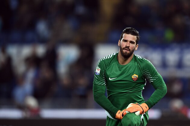 Roma's goalkeeper from Brazil Alisson Ramses Becker looks on during the Italian Serie A football match Lazio vs Roma at the Olympic Stadium in Rome on April 15, 2018. / AFP PHOTO / FILIPPO MONTEFORTE        (Photo credit should read FILIPPO MONTEFORTE/AFP/Getty Images)