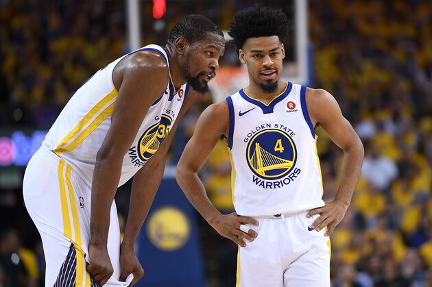 OAKLAND, CA - APRIL 14:  Quinn Cook #4 and Kevin Durant #35 of the Golden State Warriors talk with each other while there's a break in the action of the third quarter during Game One of the first round of the 2018 NBA Playoff against the San Antonio Spurs at ORACLE Arena on April 14, 2018 in Oakland, California. NOTE TO USER: User expressly acknowledges and agrees that, by downloading and or using this photograph, User is consenting to the terms and conditions of the Getty Images License Agreement.  (Photo by Thearon W. Henderson/Getty Images)
