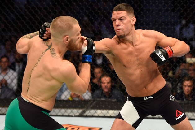 LAS VEGAS, NV - AUGUST 20:   (R-L) Nate Diaz punches Conor McGregor of Ireland in their welterweight bout during the UFC 202 event at T-Mobile Arena on August 20, 2016 in Las Vegas, Nevada. (Photo by Josh Hedges/Zuffa LLC/Zuffa LLC via Getty Images)