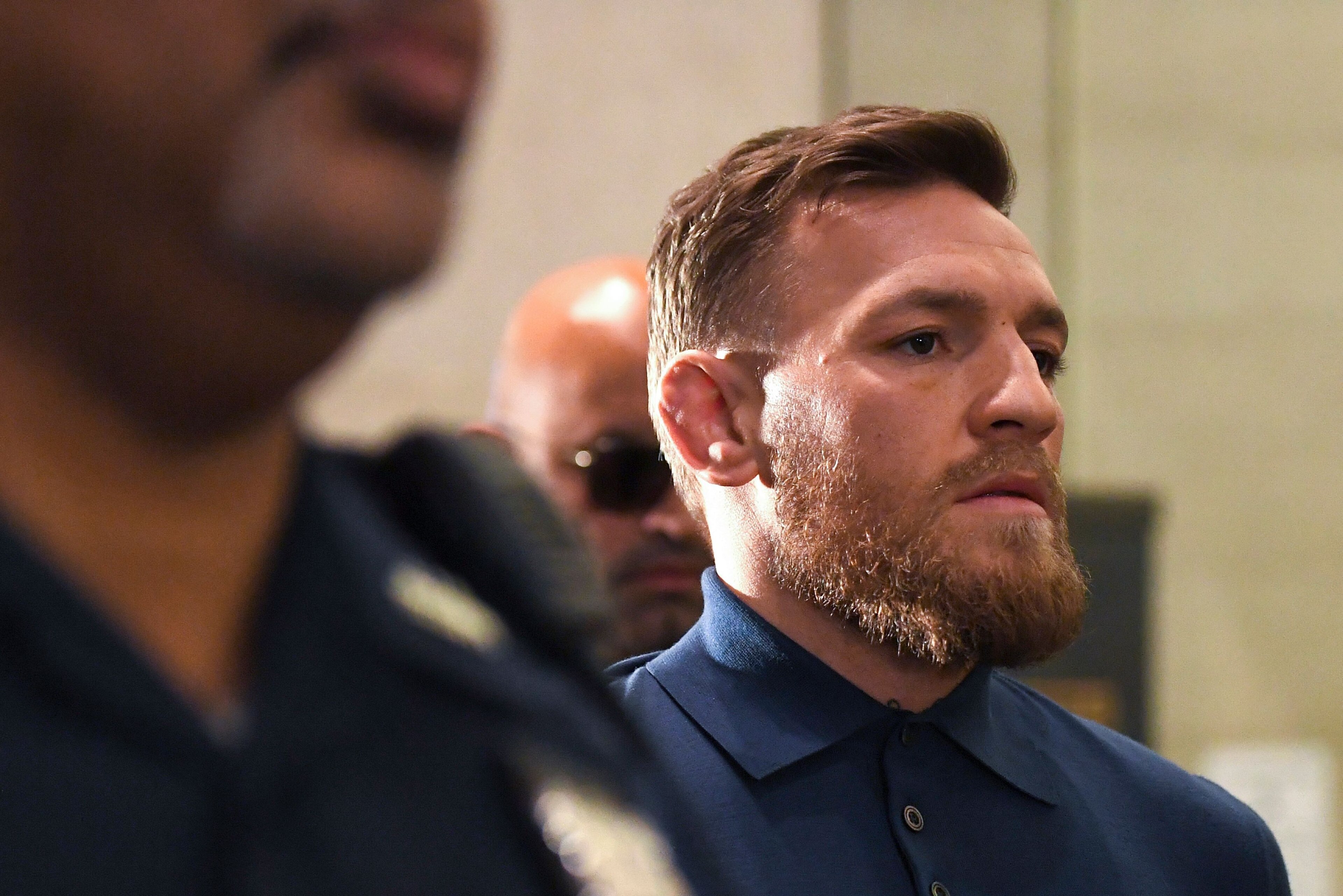Irish Mixed Martial Arts fighter Conor McGregor leaves the Kings County (Brooklyn) Criminal Court on April 6, 2018 in New York.
Irish Mixed Martial Arts fighter Conor McGregor was charged with assault and criminal mischief by New York police on April 6, 2018 and was due to appear in court. The 29-year-old superstar reportedly surrendered at a Brooklyn police station late Thursday after allegedly attacking a shuttle bus loaded with fellow mixed martial arts fighters attending a New York media event at the Barclays Center stadium.Video footage showed McGregor hurling a dolly through a side window of the bus as it moved slowly in a parking lot at the stadium in Brooklyn.
 / AFP PHOTO / ANGELA WEISS        (Photo credit should read ANGELA WEISS/AFP/Getty Images)