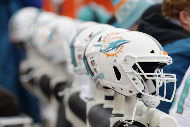 Miami Dolphins helmets are placed near the benches during the second half of an NFL football game between the Buffalo Bills and the Miami Dolphins Sunday, Dec. 17, 2017, in Orchard Park, N.Y. (AP Photo/Adrian Kraus)