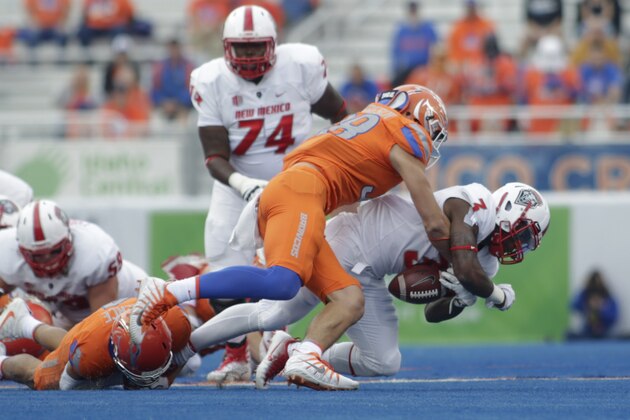 Boise State linebacker Leighton Vander Esch causes a fumble by New Mexico running back Richard McQuarley (3) during the first half of an NCAA college football game in Boise, Idaho, Thursday, Sept. 14, 2017. (AP Photo/Otto Kitsinger)