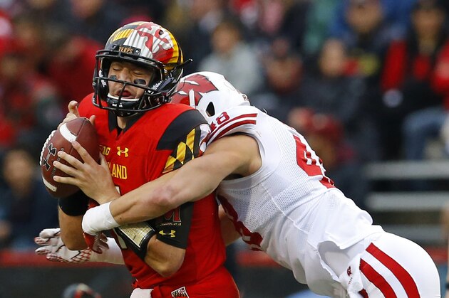 FILE - In this Nov. 7, 2015, file photo, Maryland quarterback Perry Hills, left, is sacked by Wisconsin linebacker Jack Cichy in the first half of an NCAA college football game, in College Park, Md. Maryland faces Ohio State on Saturday. The Terrapins have lost four of five, including a 59-3 humiliation at Michigan. Throw in the 101 points that Ohio State has scored in its last two games against Maryland, and this shapes up to be a huge mismatch. (AP Photo/Patrick Semansky, File)