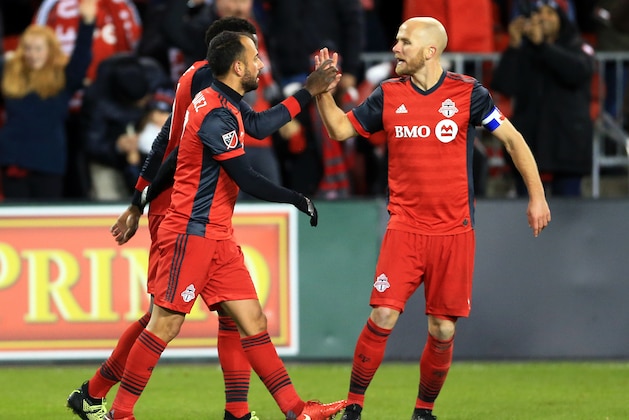 TORONTO, ON - NOVEMBER 29:  Michael Bradley #4 of Toronto FC congratulates Jozy Altidore #17 after his goal during the second half of the MLS Eastern Conference Finals, Leg 2 game against Columbus Crew SC at BMO Field on November 29, 2017 in Toronto, Ontario, Canada.  (Photo by Vaughn Ridley/Getty Images)