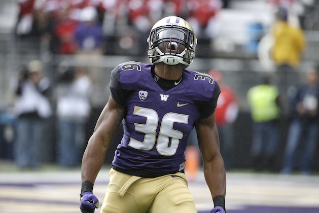 FILE - In this Sept. 3, 2016, file photo, Washington's Azeem Victor reacts to a play against Rutgers in the first half of an NCAA college football game, in Seattle. In the midst of being the starting middle linebacker for the No. 4 team in the country, Azeem Victor is trying to do more. Victor’s goals go beyond what he’s doing on the field for Washington and what he’s doing in getting his education. In Victor’s case, doing more means starting a foundation while a college student and football player. (AP Photo/Elaine Thompson, File)