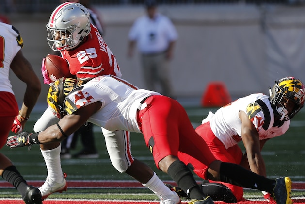 Ohio State running back Mike Weber, left, runs the ball against Maryland linebacker Jermaine Carter during the first half of an NCAA college football game Saturday, Oct. 7, 2017, in Columbus, Ohio. (AP Photo/Jay LaPrete)