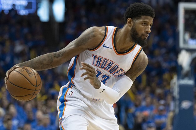 OKLAHOMA CITY, OK - APRIL 15: Paul George #13 of the Oklahoma City Thunder works the ball against the Utah Jazz during the second half of  Game One of the Western Conference in the 2018 NBA Playoffs at the Chesapeake Energy Arena on April 15, 2018 in Oklahoma City, Oklahoma. NOTE TO USER: User expressly acknowledges and agrees that, by downloading and or using this photograph, User is consenting to the terms and conditions of the Getty Images License Agreement. (Photo by J Pat Carter/Getty Images) *** Local Caption *** Paul George;
