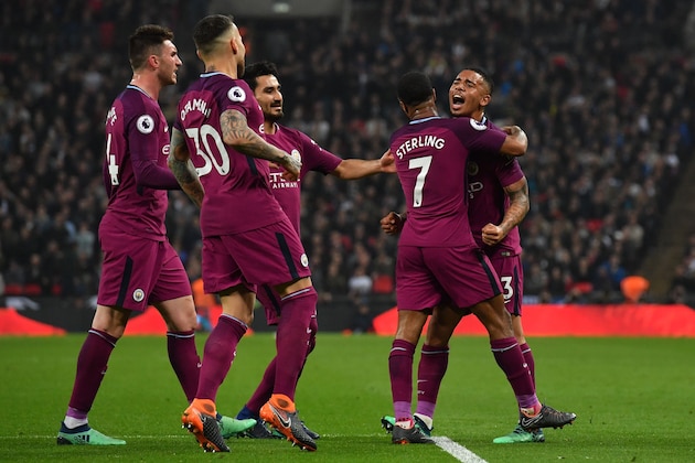 Manchester City's English midfielder Raheem Sterling (2nd R) celebrates with Manchester City's Brazilian striker Gabriel Jesus (R) and teammates after scoring their third goal during the English Premier League football match between Tottenham Hotspur and Manchester City at Wembley Stadium in London, on April 14, 2018. / AFP PHOTO / Ben STANSALL / RESTRICTED TO EDITORIAL USE. No use with unauthorized audio, video, data, fixture lists, club/league logos or 'live' services. Online in-match use limited to 75 images, no video emulation. No use in betting, games or single club/league/player publications. / (Photo credit should read BEN STANSALL/AFP/Getty Images) Manchester City's English midfielder Raheem Sterling (2nd R) celebrates with Manchester City's Brazilian striker Gabriel Jesus (R) and teammates after scoring their third goal during the English Premier League football match between Tottenham Hotspur and Manchester City at Wembley Stadium in London, on April 14, 2018. / AFP PHOTO / Ben STANSALL / RESTRICTED TO EDITORIAL USE. No use with unauthorized audio, video, data, fixture lists, club/league logos or 'live' services. Online in-match use limited to 75 images, no video emulation. No use in betting, games or single club/league/player publications. / (Photo credit should read BEN STANSALL/AFP/Getty Images)