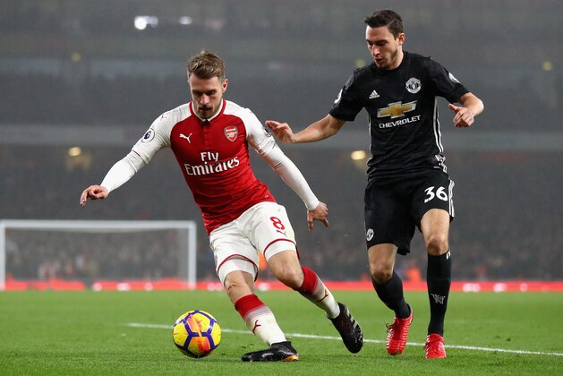 LONDON, ENGLAND - DECEMBER 02: Aaron Ramsey of Arsenal is challenged by Matteo Darmian of Manchester United during the Premier League match between Arsenal and Manchester United at Emirates Stadium on December 2, 2017 in London, England.  (Photo by Julian Finney/Getty Images)