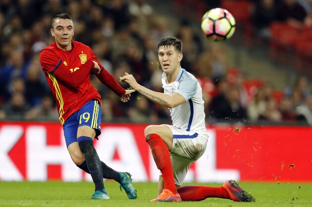 Spain's Iago Aspas, left, scores his side's first goal during the international friendly soccer match between England and Spain at Wembley stadium in London, Tuesday, Nov. 15, 2016. (AP Photo/Frank Augstein)