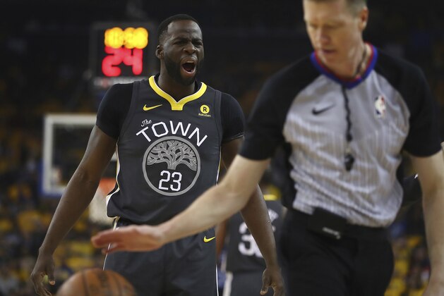 Golden State Warriors' Draymond Green, left, yells at a referee during the first quarter in Game 2 of a first-round NBA basketball playoff series against the San Antonio Spurs, Monday, April 16, 2018, in Oakland, Calif. (AP Photo/Ben Margot)