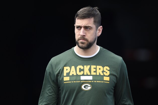 Green Bay Packers' Aaron Rodgers walks onto the field before an NFL football game against the Carolina Panthers in Charlotte, N.C., Sunday, Dec. 17, 2017. (AP Photo/Mike McCarn)