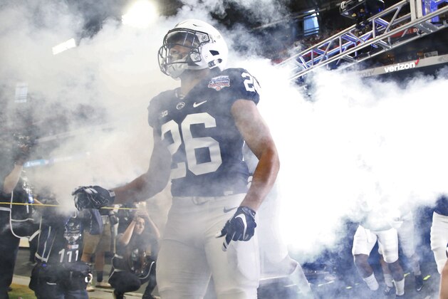 Penn State running back Saquon Barkley (26) the field with his teammates prior to the Fiesta Bowl NCAA college football game against Washington, Saturday, Dec. 30, 2017, in Glendale, Ariz. (AP Photo/Ross D. Franklin)