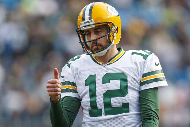 Green Bay Packers quarterback Aaron Rodgers (12) gives a thumbs up to a teammate against the Carolina Panthers during an NFL game in Charlotte, N.C. on Sunday, Dec. 17, 2017. (Chris Keane/AP Images for Panini)