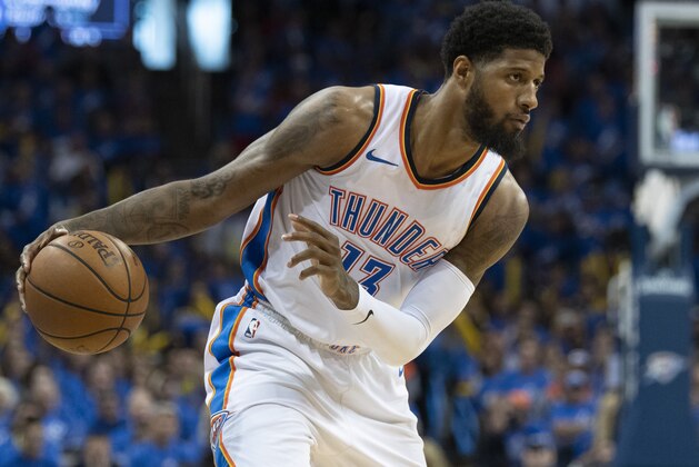 OKLAHOMA CITY, OK - APRIL 15: Paul George #13 of the Oklahoma City Thunder works the ball against the Utah Jazz during the second half of  Game One of the Western Conference in the 2018 NBA Playoffs at the Chesapeake Energy Arena on April 15, 2018 in Oklahoma City, Oklahoma. NOTE TO USER: User expressly acknowledges and agrees that, by downloading and or using this photograph, User is consenting to the terms and conditions of the Getty Images License Agreement. (Photo by J Pat Carter/Getty Images) *** Local Caption *** Paul George;