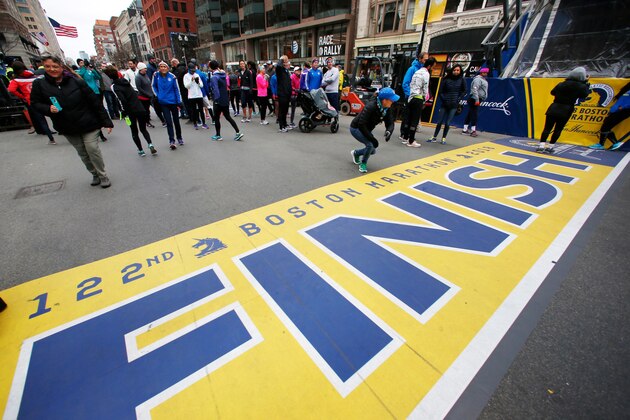 People gather at the Boston Marathon finish line in Boston, Sunday, April 15, 2018 ahead of Monday's race. (AP Photo/Michael Dwyer) People gather at the Boston Marathon finish line in Boston, Sunday, April 15, 2018 ahead of Monday's race. (AP Photo/Michael Dwyer)