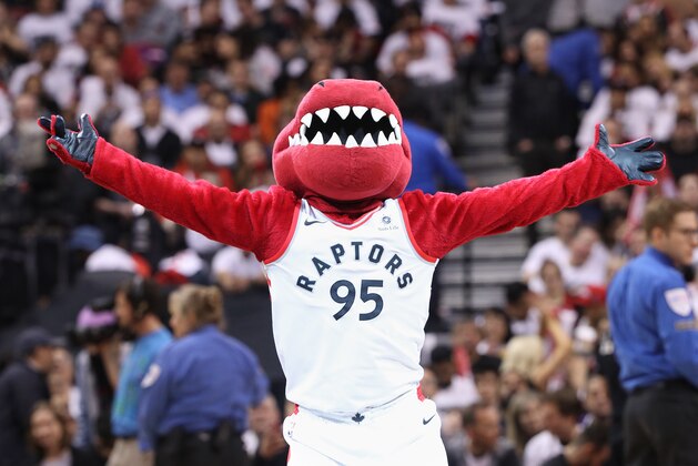 TORONTO, ON - APRIL 14: Raptor the mascot of the Toronto Raptors performs during a break in the action of the game against the Washington Wizards during Game One of the first round of the 2018 NBA Playoffs at Air Canada Centre on April 14, 2018 in Toronto, Canada. NOTE TO USER: User expressly acknowledges and agrees that, by downloading and or using this photograph, User is consenting to the terms and conditions of the Getty Images License Agreement. (Photo by Tom Szczerbowski/Getty Images) *** Local Caption *** Raptor