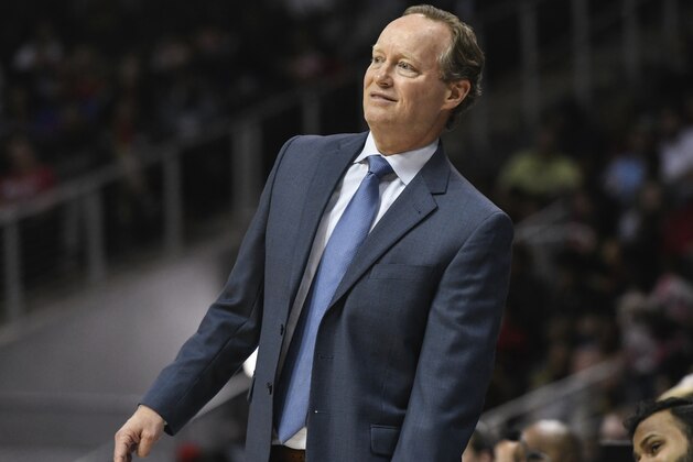 Atlanta Hawks coach Mike Budenholzer watches a three point try during the second half of an NBA basketball game against the Philadelphia 76ers Tuesday, April 10, 2018, in Atlanta. Philadelphia won 121-113. (AP Photo/John Amis)