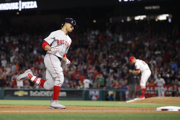 Boston Red Sox's Mookie Betts rounds the bases after hitting a home run, his second of the night, during the third inning of the team's baseball game against the Los Angeles Angels, Tuesday, April 17, 2018, in Anaheim, Calif. (AP Photo/Jae C. Hong)