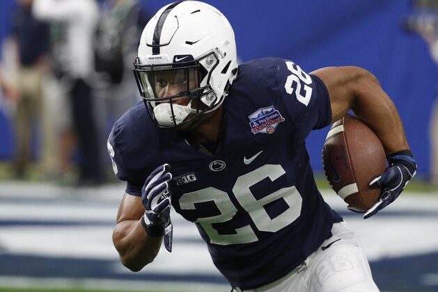 Penn State running back Saquon Barkley (26) against Washington during the Fiesta Bowl NCAA college football game, Saturday, Dec. 30, 2017, in Glendale, Ariz. (AP Photo/Rick Scuteri)