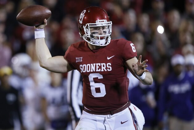 Oklahoma quarterback Baker Mayfield (6) throws during an NCAA college football game in Norman, Okla., Saturday, Nov. 11, 2017. Oklahoma won 38-20. (AP Photo/Sue Ogrocki)