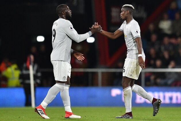 Manchester United's French midfielder Paul Pogba (R) shakes hands with Manchester United's Belgian striker Romelu Lukaku after being substituted during the English Premier League football match between Bournemouth and Manchester United at the Vitality Stadium in Bournemouth, southern England on April 18, 2018. / AFP PHOTO / Glyn KIRK / RESTRICTED TO EDITORIAL USE. No use with unauthorized audio, video, data, fixture lists, club/league logos or 'live' services. Online in-match use limited to 75 images, no video emulation. No use in betting, games or single club/league/player publications.  /         (Photo credit should read GLYN KIRK/AFP/Getty Images)
