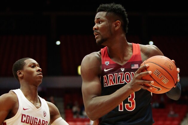 PULLMAN, WA - JANUARY 31:  Deandre Ayton #13 of the Arizona Wildcats controls the ball against Viont'e Daniels #4  of the Washington State Cougars in the first half at Beasley Coliseum on January 31, 2018 in Pullman, Washington.  Arizona defeated Washington State 100-72.  (Photo by William Mancebo/Getty Images)