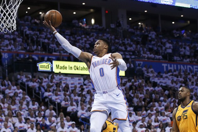 Oklahoma City Thunder guard Russell Westbrook (0) shoots in front of Utah Jazz guard Ricky Rubio (3) and forward Derrick Favors (15) during the first half of Game 2 of an NBA basketball first-round playoff series in Oklahoma City, Wednesday, April 18, 2018. (AP Photo/Sue Ogrocki)