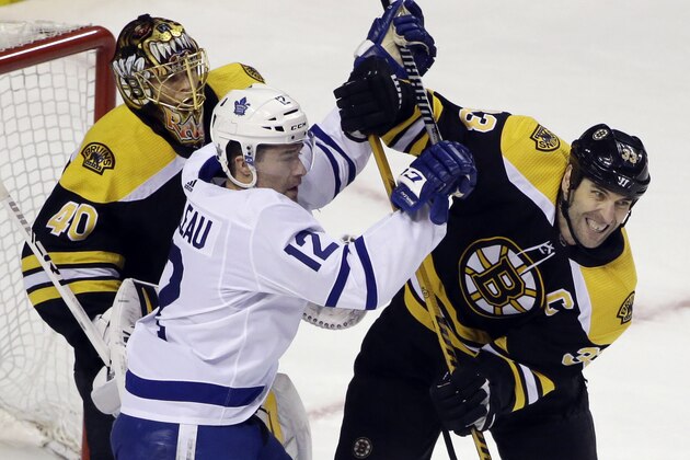 Toronto Maple Leafs center Patrick Marleau (12) struggles for position against Boston Bruins defenseman Zdeno Chara (33) in front of Bruins goaltender Tuukka Rask (40) during the first period of Game 1 of an NHL hockey first-round playoff series Thursday, April 12, 2018, in Boston. (AP Photo/Elise Amendola) Toronto Maple Leafs center Patrick Marleau (12) struggles for position against Boston Bruins defenseman Zdeno Chara (33) in front of Bruins goaltender Tuukka Rask (40) during the first period of Game 1 of an NHL hockey first-round playoff series Thursday, April 12, 2018, in Boston. (AP Photo/Elise Amendola)
