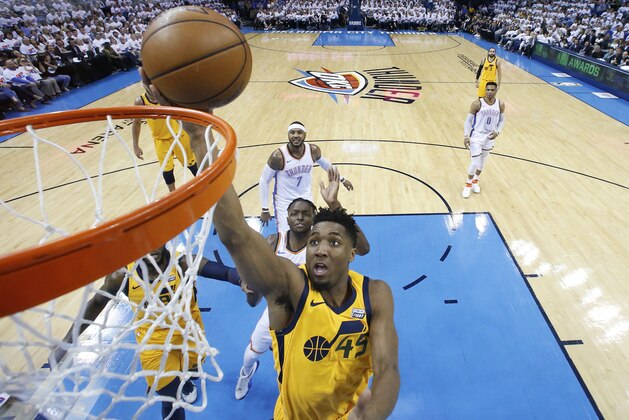 Utah Jazz guard Donovan Mitchell (45) shoots during the first half of Game 2 of an NBA basketball first-round playoff series against the Oklahoma City Thunder in Oklahoma City, Wednesday, April 18, 2018. (AP Photo/Sue Ogrocki)