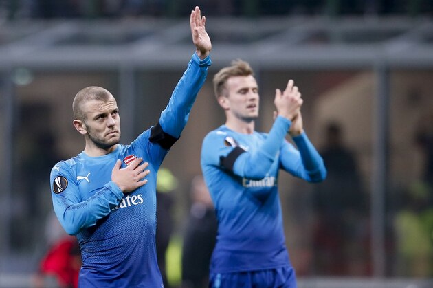 Arsenal's Jack Wilshere waves to fans at the end of the Europa League, round of 16 first-leg soccer match between AC Milan and Arsenal, at the Milan San Siro stadium, Italy, Thursday, March 8, 2018. Arsenal won 2-0. (AP Photo/Antonio Calanni)